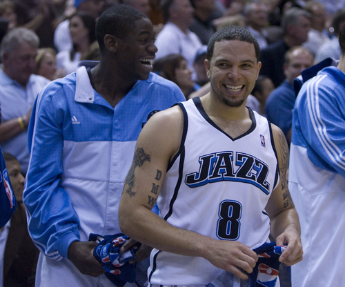 Ronnie Brewer, left, and Deron Williams are all smiles as the Jazz pull ahead late in their win over the Rockets in Game 6.
   Rick Egan/TheSalt Lake Tribune   5/2/08