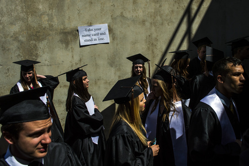 Chris Detrick  |  The Salt Lake Tribune
Utah State University students wait outside after the undergraduate Commencement Ceremony at Dee Glen Smith Spectrum Saturday May 3, 2014.
