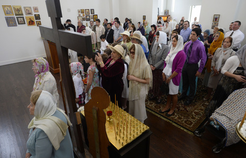 Steve Griffin  |  The Salt Lake Tribune

Parishioners attend the consecration service at the new St. George Russian Orthodox Church in West Jordan Sunday, May 4, 2014. The parish has existed since 2005, but this is the group's first church building. St. George Russian Orthodox Church priest Michael van Opstall was joined by Archbishop Kyrill of San Francisco and other dignitaries during the event.