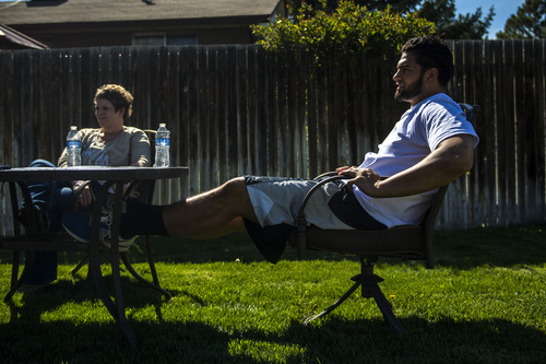 Chris Detrick  |  The Salt Lake Tribune
Former Utah State tight end D.J. Tialavea hangs out with his mom Tami at their home in West Jordan Friday May 2, 2014.