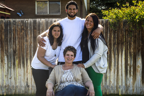Chris Detrick  |  The Salt Lake Tribune
Former Utah State tight end D.J. Tialavea poses for a portrait with his mom Tami and sisters Abigail and Julianne at their home in West Jordan Friday May 2, 2014.