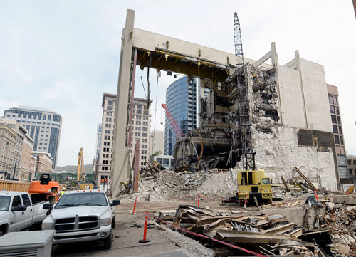 Steve Griffin  |  The Salt Lake Tribune

Crews demolish the old Prudential Federal Savings and Loan Building on Main Street between 100 and 200 South as they make room for the new Performing Arts Center in Salt Lake City Monday, May 5, 2014. The Prudential Federal Savings and Loan Building was designed by architect William Pereira who also designed the Transamerica Pyramid in San Francisco.