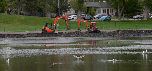 Franciso Kjolseth  |  The Salt Lake Tribune
Crews work to expand the shoreline of the Liberty Park pond with plans to put in more plants and grasses for the birds along the edges and install a floating island. Mayor Ralph Becker just released his proposed budget of 229 million for Salt Lake's 2014-15 fiscal year that creates a set aside for parks and other infrastructure to cover costs.