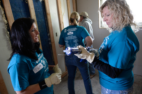 Franciso Kjolseth  |  The Salt Lake Tribune
Renee Jardine, left, and Tresia Lindsay work on laying down sub-floor as part of National Women Build Week. Female students, faculty and staff from Utah Valley University and Brigham Young University have been working together to rebuild a home to help a family in need on Wednesday, May 7, on a Habitat for Humanity home in Utah County. The women along with one of the home owners got dirty and kept busy on the historic 1880's George Taylor, Jr. Home at 187 North 400 West, in Provo.