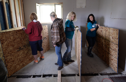 Franciso Kjolseth  |  The Salt Lake Tribune
Marykae Blair, left, is joined by Tera Prestwich, Tresia Linsday and Renee Jardine with Utah Valley University Women's Success Center as part of National Women Build Week. Female students, faculty and staff from UVU and Brigham Young University have been working together to rebuild a home for Blair and her family on Wednesday, May 7, on a Habitat for Humanity home in Provo.