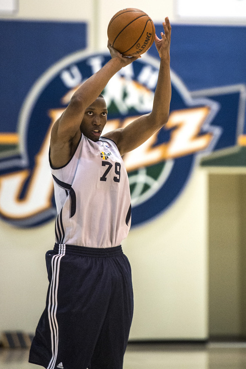 Chris Detrick  |  The Salt Lake Tribune
Akil Mitchell (79) shoots around during a workout at the Zions Bank Basketball Center Wednesday May 7, 2014.