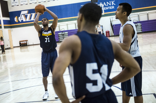 Chris Detrick  |  The Salt Lake Tribune
Mike Moser (71) Bryce Cotton (51) and Stephen Holt (64) shoot around during a workout at the Zions Bank Basketball Center Wednesday May 7, 2014.
