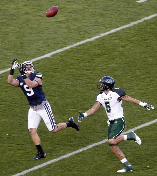 Chris Detrick  |  The Salt Lake Tribune
Brigham Young Cougars defensive back Daniel Sorensen (9) intercepts the ball intended for Hawaii Warriors wide receiver Billy Ray Stutzmann (5) during the first half of the game at LaVell Edwards Stadium Friday September 28, 2012. BYU is winning the game 20-0.