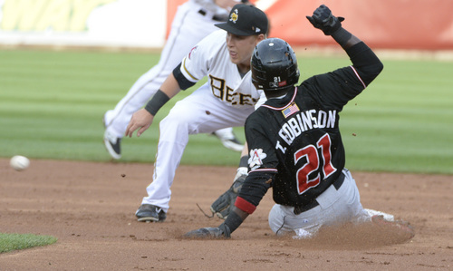 Rick Egan  |  The Salt Lake Tribune

Salt Lake Bees second baseman Taylor Lindsey (8) waits for the throw as Albuquerque Isotopes outfielder Trayvon Robinson (21) is tagged out on a stolen base attempt, in Pacific Coast League action, The Salt Lake Bees, vs The Albuquerque Isotopes, at Smiths Ballpark,  Monday, April 21, 2014