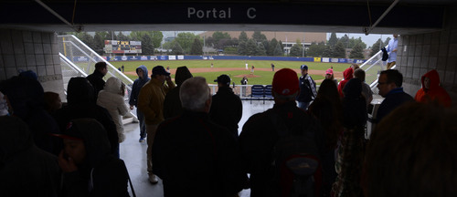 Steve Griffin  |  The Salt Lake Tribune


Fans trying to stay dry stand in portal C as they watch the rain fall during baseball game between BYU and Utah at Miller Park on the campus of BYU in Provo, Utah Tuesday, May 6, 2014.