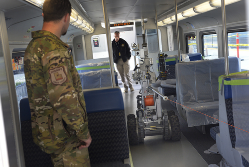 Scott Sommerdorf   |  The Salt Lake Tribune
A police robot slowly advances on an area of the train where a sniper had killed a "terrorist" with a bomb strapped to his body. The Utah Transit Authority held a terrorism bombing drill at the Murray Central Station in conjunction with Intermountain Medical Center, Thursday, May 8, 2014.