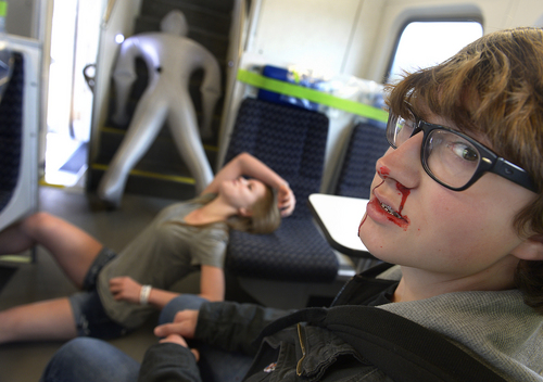Scott Sommerdorf   |  The Salt Lake Tribune
Students played the role of injured "passengers" as UTA held a terrorism bombing drill at the Murray Central Station in conjunction with Intermountain Medical Center, Thursday, May 8, 2014.