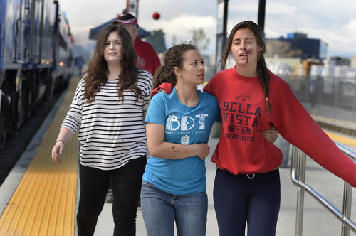 Scott Sommerdorf   |  The Salt Lake Tribune
Students playing the role of injured "passengers" help each other to the triage station as UTA held a terrorism bombing drill at the Murray Central Station in conjunction with Intermountain Medical Center, Thursday, May 8, 2014.