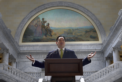 Scott Sommerdorf   |  The Salt Lake Tribune
Utah Attorney General Sean Reyes, under a mural in the rotunda of the State Capitol depicting Utah pioneers, speaks about the importance of remembering and honoring the primarily Chinese laborers who constructed and completed America's first transcontinental railroad. Representatives from Utah Gov. Gary Herbert's office joined other elected officials, including visitors from China's Guandong Province on Friday. The event is part of the official commemoration of the May 10, 1869, driving of the Golden Spike that marked the connection of the Union and Central Pacific Railroads at Promontory Point, Utah.