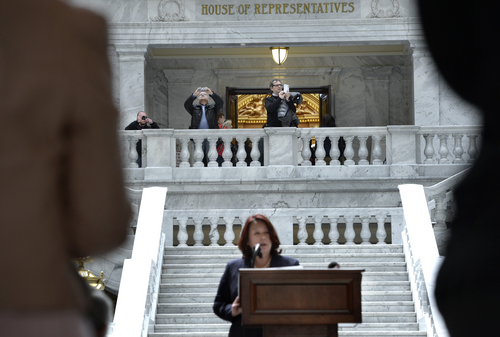 Scott Sommerdorf   |  The Salt Lake Tribune
As tourists to the Utah State Capitol building snap photos of the rotunda, Salt Lake County Deputy Mayor Nicole Dunn speaks to recognize and honor the role played by primarily Chinese laborers in constructing and completing America's first transcontinental railroad, Friday, May 9, 2014. The event was part of the official commemoration of the Ma, 10, 1869, driving of the Golden Spike that marked the connection of the Union and Central Pacific Railroads at Promontory Point, Utah.