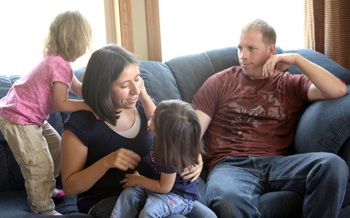 Al Hartmann  |  The Salt Lake Tribune
Caren and Ben Moon play with their daughters Raygan and Jordyn in their home in Vernal.  Caren miscarried last November but is pregnant again. The couple have taken steps to protect the unborn baby from air pollution by installing air and water filters in their home. to air pollution from oil and gas drilling.