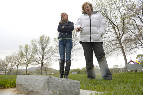 Al Hartmann  |  The Salt Lake Tribune
Midwife Donna Young and her daughter Holt, look at a grave marker of a stillborn child in Rock Point Cemetery in Maeser just north of Vernal.  She started noticing a higher than usual amounts of stillborn and newborn deaths in the area the past few years.  One corner of the cemetery has several small markers for stillborn and newborn  deaths.    
The TriCounty Health Department is holding a public meeting Wednesday May 7 to investigate the uptick in stillbirths and newborn deaths in the area. Environmentalists believe there's a connection to air pollution from oil and gas drilling.