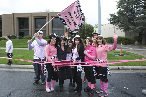 Melissa Majchrzak  |  Special to the Tribune
The "Protect Your Treasure Chest" group at the finish line of the Susan G. Komen 18th Annual Race for the Cure at Library Square.