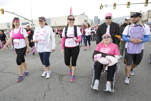 Melissa Majchrzak  |  Special to the Tribune
The Wandering Warriors walk for Wanda Jolley, who has been cancer-free for two years and blind since birth, at the Susan G. Komen 18th Annual Race for the Cure at Library Square.