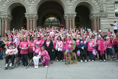Melissa Majchrzak  |  Special to the Tribune
Breast cancer survivors pose for a photo after the Susan G. Komen 18th Annual Race for the Cure at Library Square.