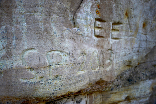 Leah Hogsten  |  The Salt Lake Tribune
Fresh graffiti signed "S.P. 2013" scars the canyon wall at the entrance to Recapture Canyon not far from Browns Canyon Road trailhead, April 26, 2014, in the vicinity of Ancestral Puebloan cliff dwellings. Recapture Canyon, near Blanding is rich in archaeological sites and some environmentalists believe restricting access to hikers and horseback riders is the best way to protect the sites and others say allowing more people to ride motorized ATV's there puts more eyes in the canyon to discourage vandals.