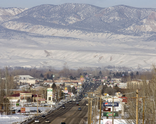 FILE - In this Feb. 10, 2011 file photo, downtown Vernal, Utah is shown. State health officials are pledging to look into claims that stillbirths are on the rise in the Eastern Utah community of Vernal, that is home to a boom in gas and oil development. Activists say a climbing rate of neonatal deaths in the Uinta Basin stems from industrial smog. But researchers and health officials aren't ready to draw such a link.  (AP Photo/The Salt Lake Tribune, Steve Griffin, File)