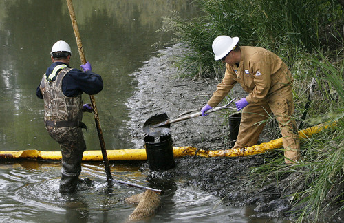 Scott Sommerdorf  |  Salt Lake Tribune
OIL SPILL
This two-man Chevron cleanup crew laboriously removed oil shovel-full by shovel-full from the fouled banks of  the Jordan River at 1300 South and 900 West, Sunday 6/13/10.