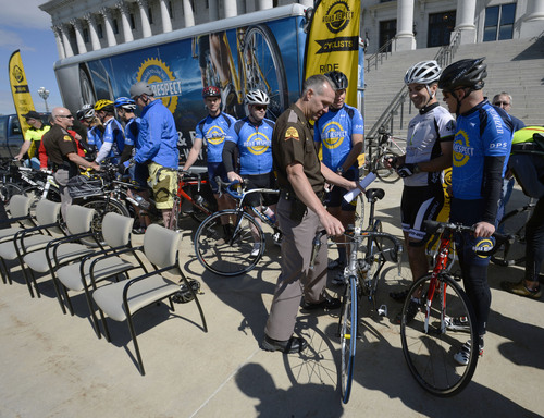 Steve Griffin  |  The Salt Lake Tribune


Utah Highway Patrol Superintendent Daniel Fuhr checks out some of the bikes during a press conference kicking off the 4th annual 2014 Road Respect Tour. The tour is designed to encourage safe cycling and to promote positive interactions between bicyclists and drivers. The event is sponsored by Bike Utah, the Utah Department of Transportation, the Department of Public Safety, Utah Highway Patrol and Zero Fatalities. The event was held  on the steps of the Capitol in Salt Lake City, Monday, May 12, 2014.