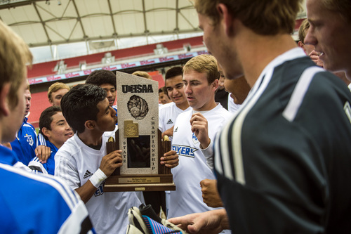 Chris Detrick  |  The Salt Lake Tribune
Dixie's Luis Bernabe (6) kisses the trophy while celebrating with his team after winning the 3A championship game against Cedar City at Rio Tinto Stadium Saturday May 10, 2014. Dixie won the game 3-1.