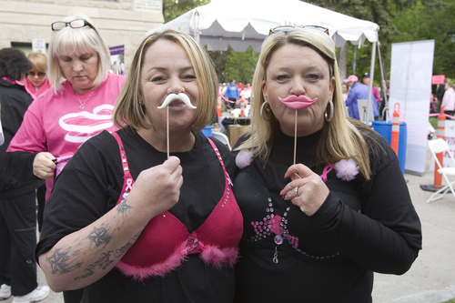 Melissa Majchrzak  |  Special to the Tribune
Kimberly Babbel, four-year breast cancer survivor, and her friend, Carrie Carlson, 12-year breast cancer survivor, attend the Susan G. Komen 18th Annual Race for the Cure at Library Square.