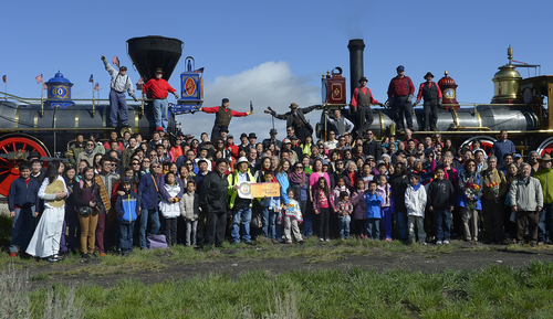 Scott Sommerdorf   |  The Salt Lake Tribune
The Chinese community honored Chinese immigrants who built the railroad from the west by posing more than three busloads of people into a photo at the Golden Spike National Monument on the 145th commemoration of the completion of the transcontinental railroad on Saturday.