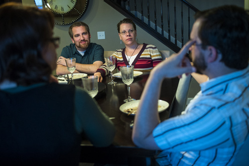 Chris Detrick  |  The Salt Lake Tribune
Rick and Desi Parker, back, talk with Ethan and Libby Sproat, front, talk during a Childless Mormon Support dinner Friday May 9, 2014.