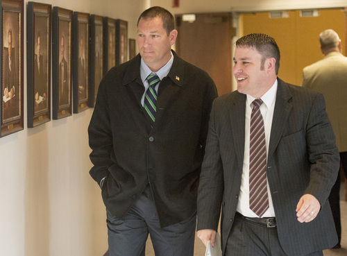 Rick Egan  |  The Salt Lake Tribune

John Coyle (left) leaves West Valley City's civil service commission hearing with attorney Blake Hamilton, Thursday, May 15, 2014. The civil service commission overturned the demotion of Lt. Coyle, and ordered the department to award him back pay.