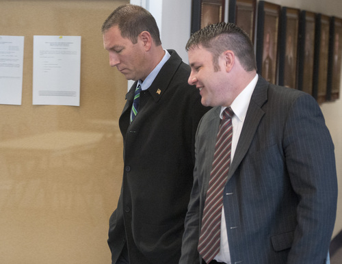 Rick Egan  |  The Salt Lake Tribune

John Coyle (left) leaves the West Valley City civil service commission hearing with attorney Blake Hamilton, Thursday, May 15, 2014. The civil service commission overturned the demotion of Lt. Coyle, and ordered the department to award him back pay.