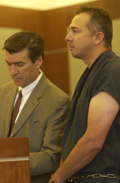 Reginald Campos, right, who is charged with attempted murder and aggravated assault, and the defense attorney Greg Skordas stand before the judge at a hearing in the 3rd District Court on Wednesday, July 29, 2009. Campos' bail was lowered from 500,000 to 100,000.
Anna Kartashova / The Salt Lake Tribune