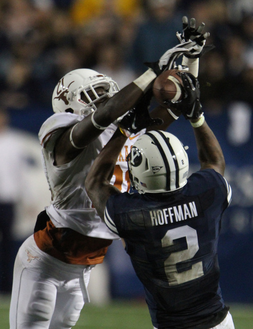 Rick Egan  | The Salt Lake Tribune 

Brigham Young Cougars wide receiver Cody Hoffman (2) catches a pass as Texas Longhorns Duke Thomas (21) defends,  as BYU played the University of Texas, Lavell Edwards stadium, Saturday, September 7, 2013.