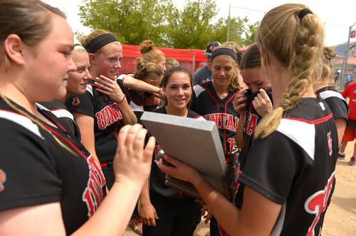 Leah Hogsten  |  The Salt Lake Tribune
Uintah holds their trophy. Stansbury High School girls softball team defeated Uintah High School 8-3 to win the 3A State Championship title Saturday, May 17, 2014 at the Spanish Fork Softball Complex.