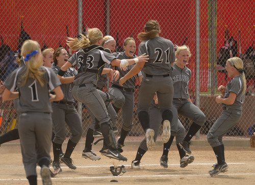 Leah Hogsten  |  The Salt Lake Tribune
Stansbury celebrates the win. Stansbury High School girls softball team defeated Uintah High School 8-3 to win the 3A State Championship title Saturday, May 17, 2014 at the Spanish Fork Softball Complex.