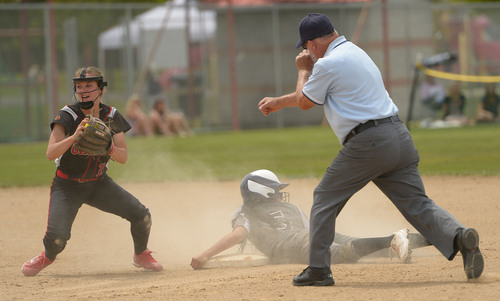 Leah Hogsten  |  The Salt Lake Tribune
Unitah's Drew Smuin makes the out on Stansbury's Janessa Bassett. Stansbury High School girls softball team defeated Uintah High School 8-3 to win the 3A State Championship title Saturday, May 17, 2014 at the Spanish Fork Softball Complex.