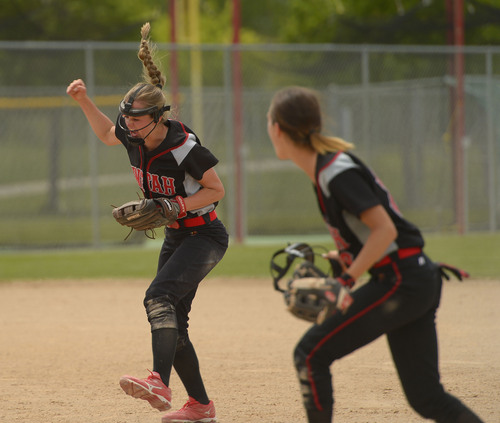 Leah Hogsten  |  The Salt Lake Tribune
Unitah's Drew Smuin celebrates the out on Stansbury's Janessa Bassett. Stansbury High School girls softball team defeated Uintah High School 8-3 to win the 3A State Championship title Saturday, May 17, 2014 at the Spanish Fork Softball Complex.