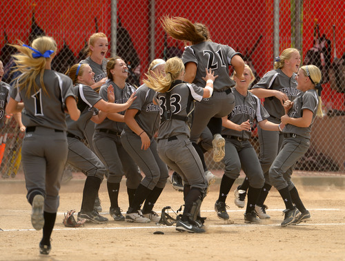 Leah Hogsten  |  The Salt Lake Tribune
Stansbury celebrates the win. Stansbury High School girls softball team defeated Uintah High School 8-3 to win the 3A State Championship title Saturday, May 17, 2014 at the Spanish Fork Softball Complex.