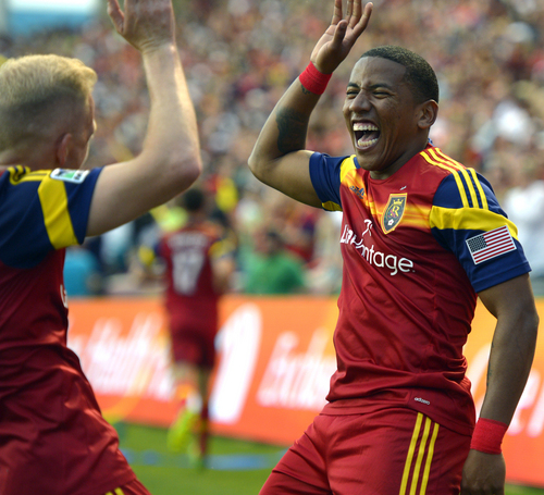 Real Salt Lake midfielder Luke Mulholland, left, congratulates Jou Plata (8) after Plata's goal in the first period of their MLS soccer match against the Colorado Rapids, Saturday, May 17 2014, in Sandy, Utah. (AP Photo/The Salt Lake Tribune, Rick Egan)  DESERET NEWS OUT; LOCAL TV OUT; MAGS OUT.