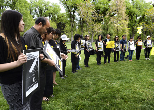 Rick Egan  |  The Salt Lake Tribune

Supporters hold signs in honor of the victims of the South Korea ferry disaster, during a rally at Liberty Park, Sunday, May 18, 2014.  The rally was held to remember, honor and pray for victims and families of the South Korea ferry disaster that killed more than 300 people, mostly high school students, on April 26. It was organized by Korean ex-patriots living in Utah as part of a 50-state rally organized by Missy USA, a social website catering to Korean and Korean American women in the U.S.