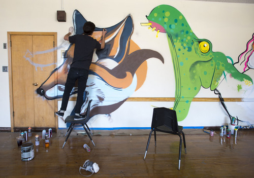 Steve Griffin  |  The Salt Lake Tribune


Artist Clay Cavenders paints a mural in a class room inside the old Granite High School building in Salt Lake City, Utah Thursday, May 15, 2014.  The old building will house "Dreamathon," an interactive art exhibit that utilizes murals, photography, music, writing and storytelling to empower visitors to discover and live their dreams. Over 150 artisans from the local community have joined together to create a landscape of dreams by transforming the main section of the historic building.