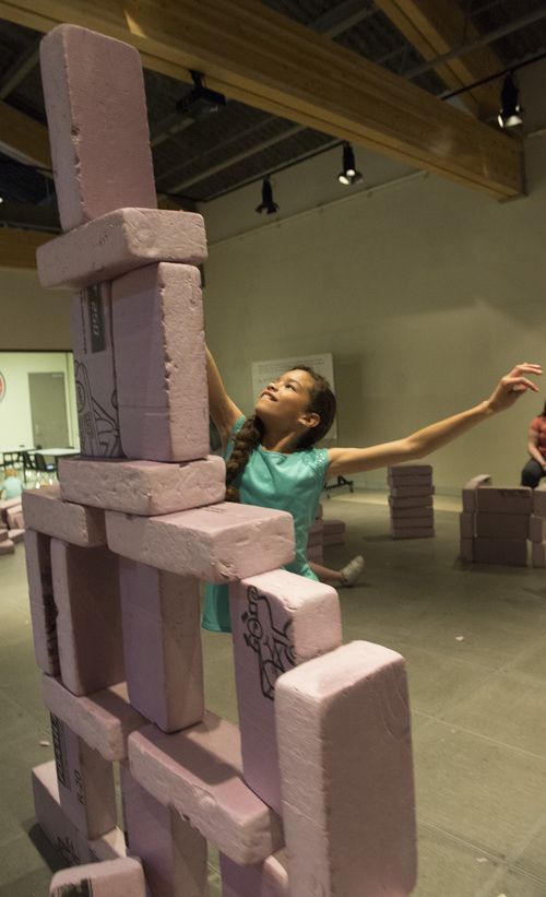 Rick Egan  |  The Salt Lake Tribune

Juliana Caballero, 10, Salt Lake attempts one more block on her structure, in the Building Curiosity room, at the Museum of Natural Curiosity, at Thanksgiving Point, Saturday, May 17, 2014