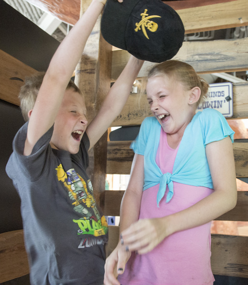 Rick Egan  |  The Salt Lake Tribune

Preston Terry 10, and Regina Terry, 12, Spanish Fork, react to 85 mph wind in the wind tunnel at the Museum of Natural Curiosity, at Thanksgiving Point, Saturday, May 17, 2014
