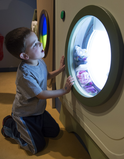 Rick Egan  |  The Salt Lake Tribune

Jax Snook, 4, Lehi, in the Suds n' Bubbles room, at the Museum of Natural Curiosity, at Thanksgiving Point, Saturday, May 17, 2014