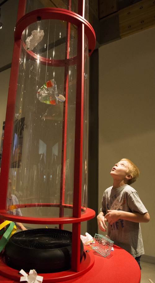 Rick Egan  |  The Salt Lake Tribune

Seven-year-old Camden Lancaster, Pleasant Grove, watches his parachute go up the wind tunnel, in the Building Curiosity room, at the Museum of Natural Curiosity, at Thanksgiving Point, Saturday, May 17, 2014