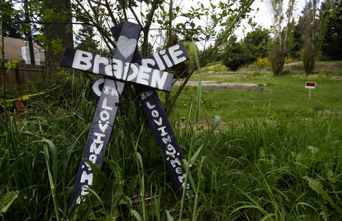 Rick Egan  | The Salt Lake Tribune 

Crosses with the names of Charlie and Braden were left near empty lot where the house once stood, in Puyallup, Washington, that Josh Powell set on fire with he and his boys inside. Thursday, May 10, 2012.