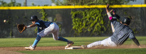 Chris Detrick  |  The Salt Lake Tribune
Layton's Frankie Aguilar (3) forces out Copper Hills' Cody Barkdull (9) at second base during the game at Kearns High School Tuesday May 20, 2014. Layton won the game 8-6.
